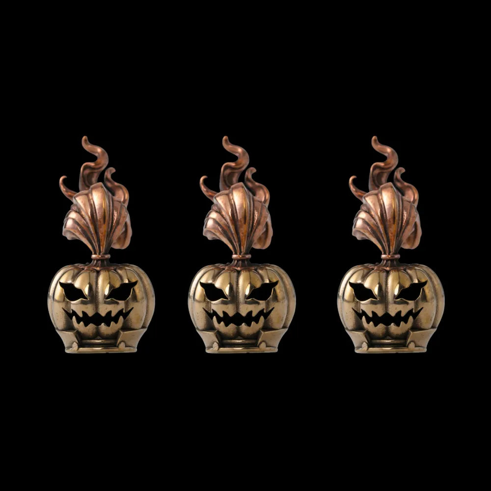 Three pumpkin heads against a black background