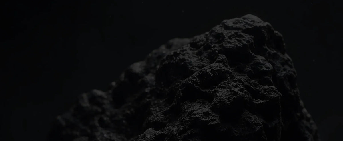 Dark rock texture behind IRONDOM brand values