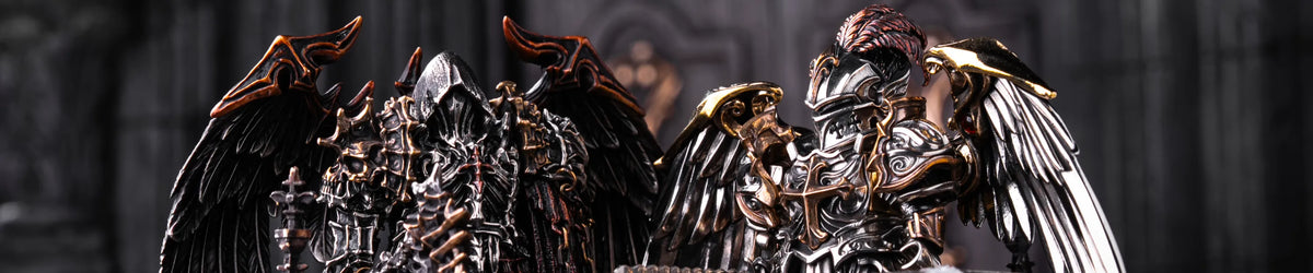 Two winged warrior miniatures standing behind a carved display stand.