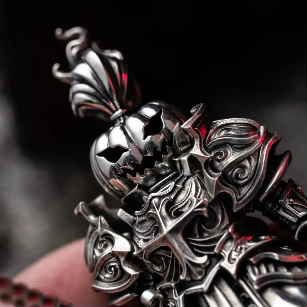 Hand holding a pumpkin-headed knight figure