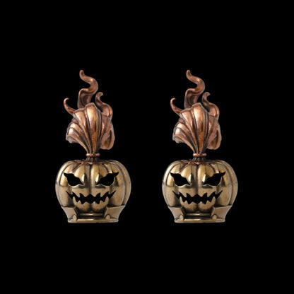 Two pumpkin heads against a black background