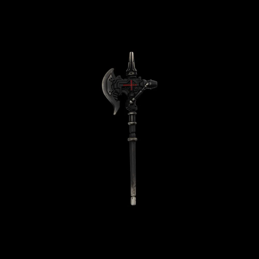 Dark miniature axe with a red cross detail on a black background