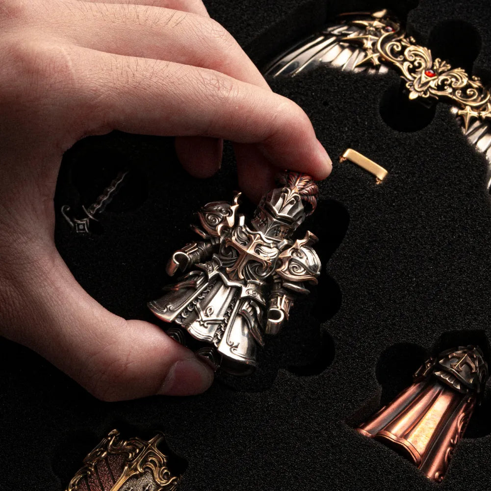 Hands assembling a Crimson Templar figure