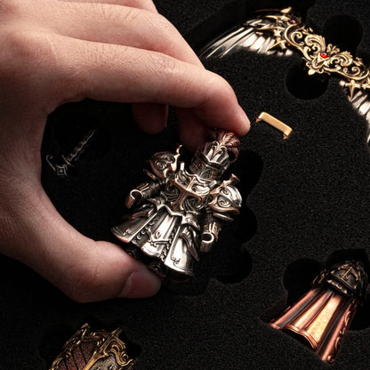 Hands assembling a Crimson Templar figure