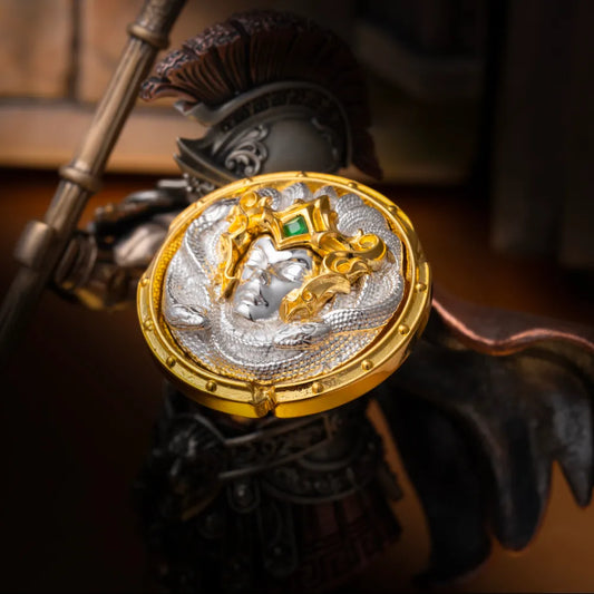 Close-up of the sculpted face and patterned rim on an Aegis of Medusa shield