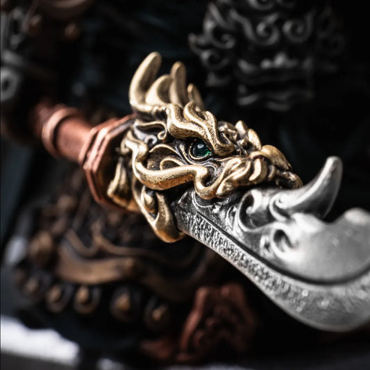 Close-up of the dragon decoration on a curved blade