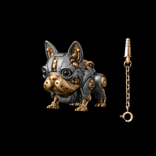 A silver-tone mechanical dog figure with gold-tone details beside a key on a chain.