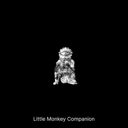 Small monkey companion figure against a black background
