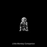 Small monkey companion figure against a black background