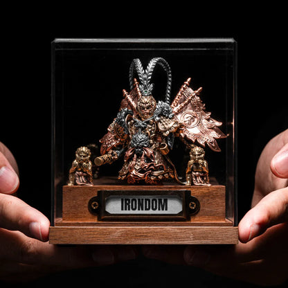 Hands holding a Wukong figure in an IRONDOM display case
