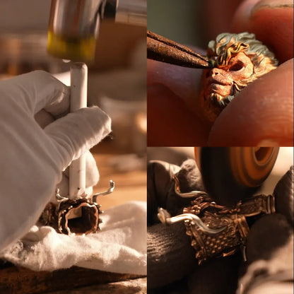Hands working on a Wukong figure head and components